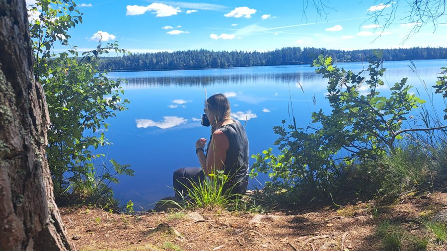Sitting quietly by a lake on a summer day