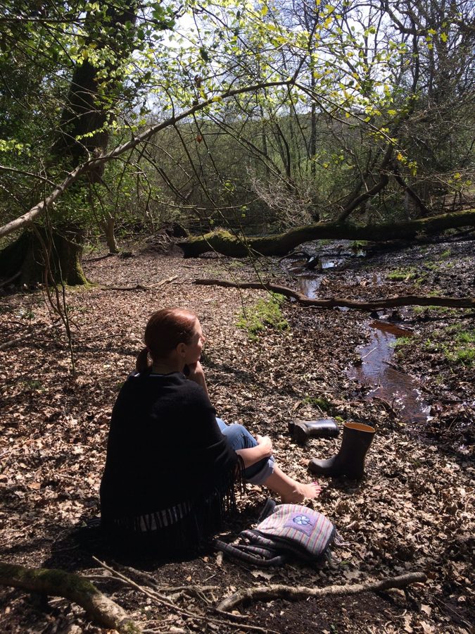 Writing in a journal, sitting quietly in the woods